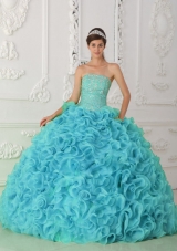 Strapless Organza Beading Ball Gown Fashionable Quinceanera Dress in Blue,Strapless dresses are one of the sexier styles on the market today. They show just enough skin to be classy without beingtoo revealing. The bodice is is accented with scattered crystals and beadings.The full skirt features rolling flowers,which makes the dress very luxurious.
