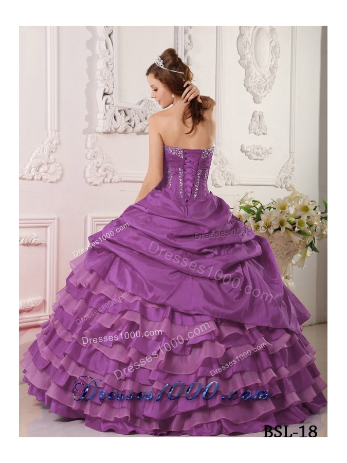 Purple Ball Gown Strapless Quinceanera Dress with Ruffled Layers and Beading