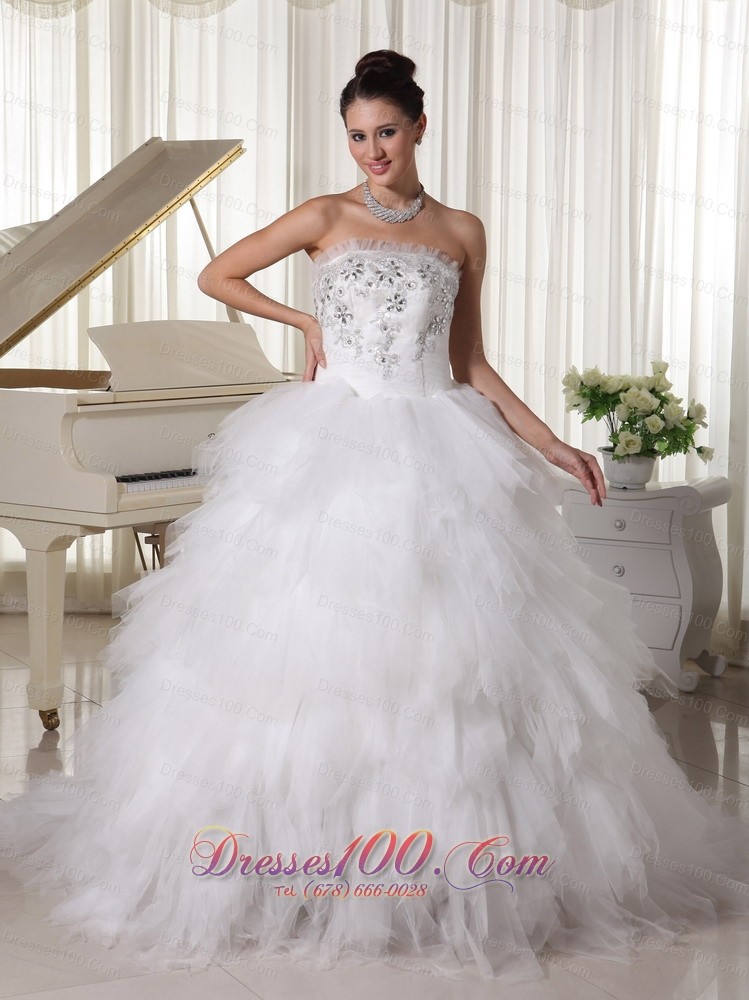 A-line Strapless Beaded Bridal Gown Tulle Ruffles Sweep Train