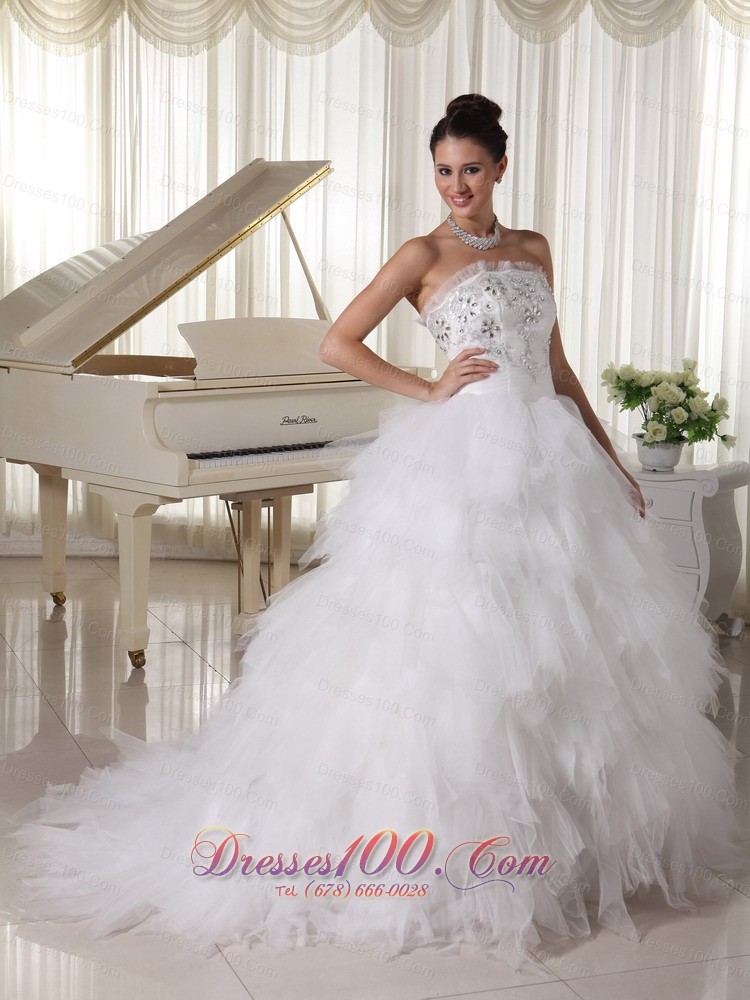 A-line Strapless Beaded Bridal Gown Tulle Ruffles Sweep Train