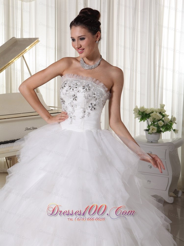 A-line Strapless Beaded Bridal Gown Tulle Ruffles Sweep Train