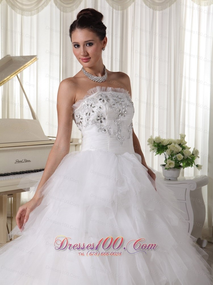 A-line Strapless Beaded Bridal Gown Tulle Ruffles Sweep Train