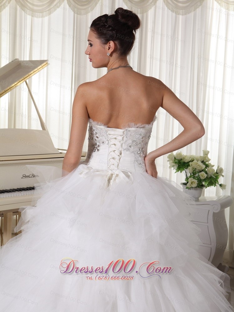 A-line Strapless Beaded Bridal Gown Tulle Ruffles Sweep Train