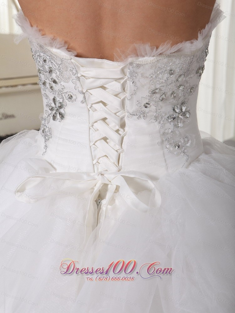 A-line Strapless Beaded Bridal Gown Tulle Ruffles Sweep Train